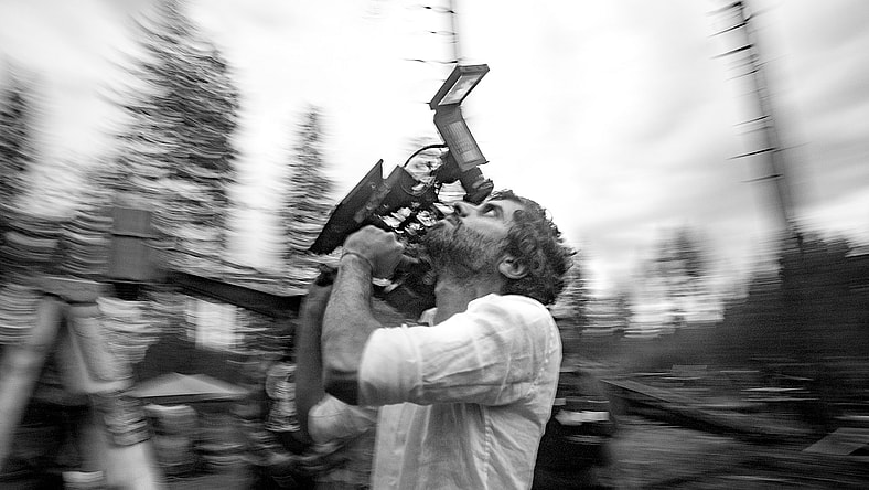 Train Dreams. Director of Photography Adolpho Veloso on the set of Train Dreams. Cr. Daniel Schaefer/BBP Train Dreams. LLC.