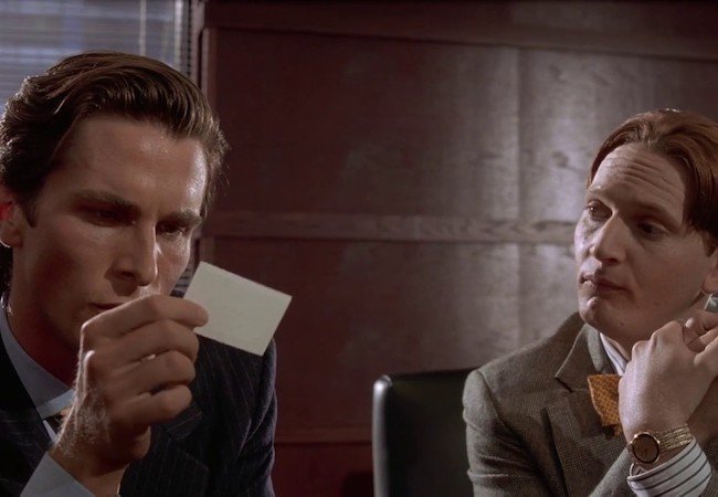 Christian Bale as Patrick Bateman and Matt Ross as Luis Carruthers in American Psycho, directed by Mary Harron and based on the novel by Bret Easton Ellis.