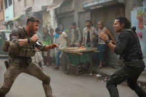 Chris Hemsworth and Randeep Hooda in the 12-minute "oner" in Extraction, directed by Sam Hargrave Keanu Reeves Charlize Theron