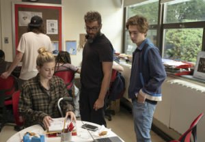 Lili Reinhart as Grace Town, Director Richard Tanne, and Austin Abrams as Henry Page behind the scenes on the set of CHEMICAL HEARTS